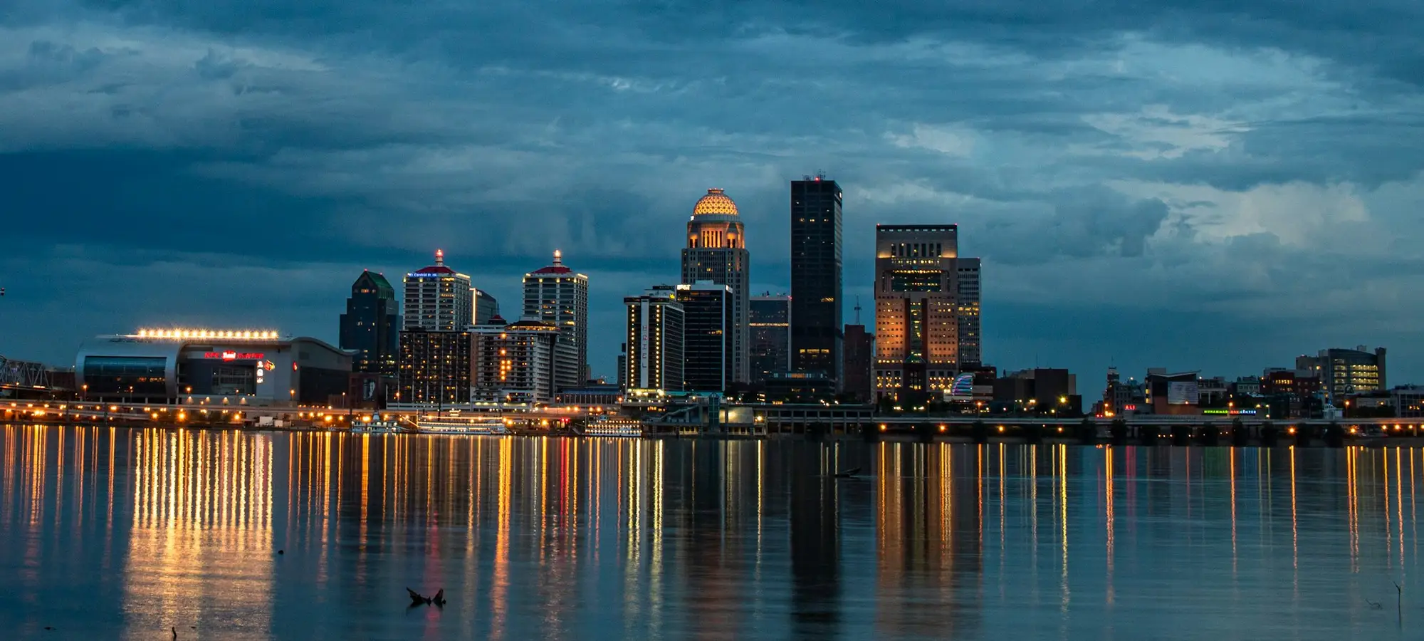 Louisville skyline reflected in the Ohio River at dusk