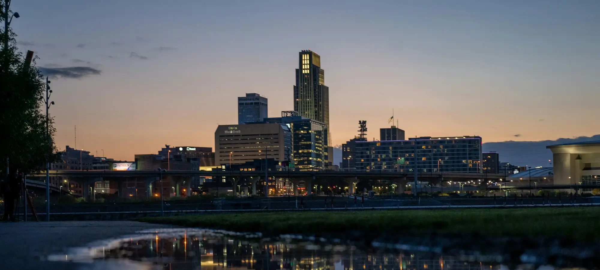Downtown Omaha skyline reflected at dusk