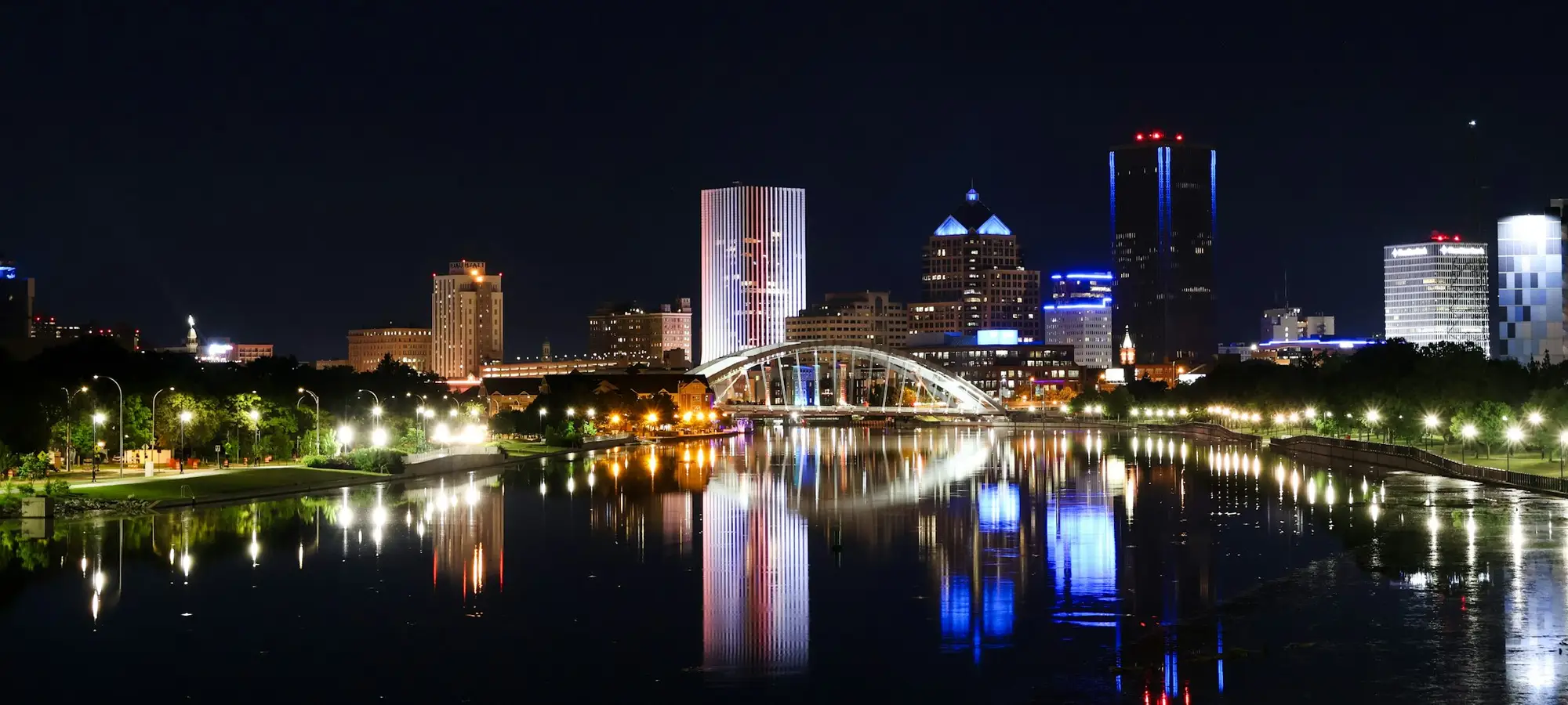 Downtown Rochester, New York, lit up at night along the river