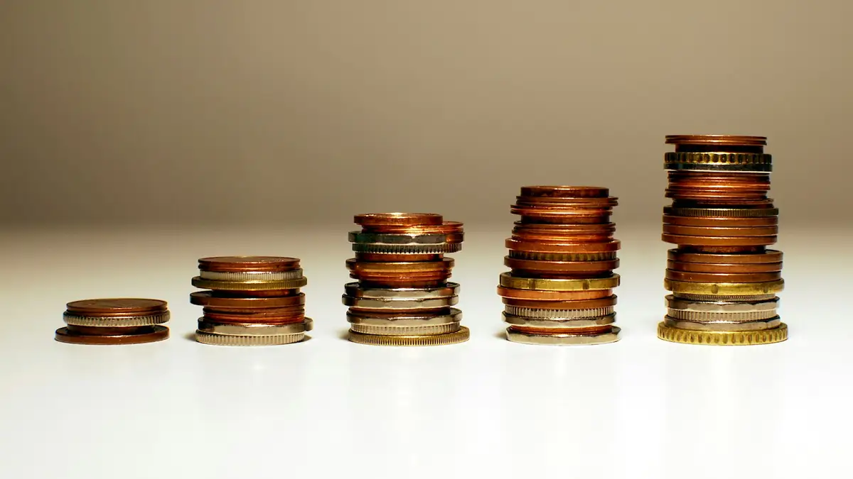 Stacks of coins growing from left to right