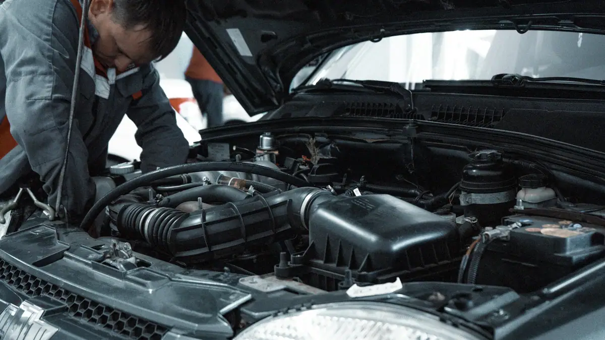 Mechanic inspecting a car engine