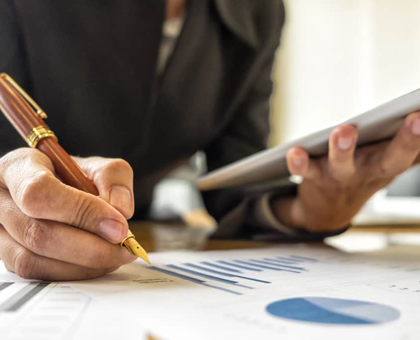 Person Analyzing Investment Charts